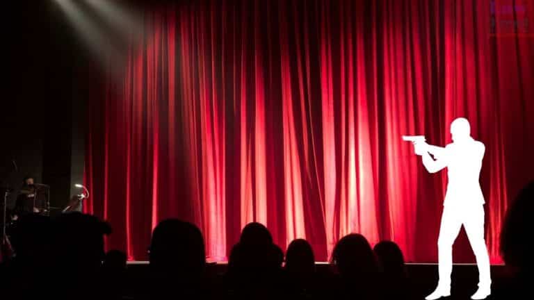 person with gun in theatre