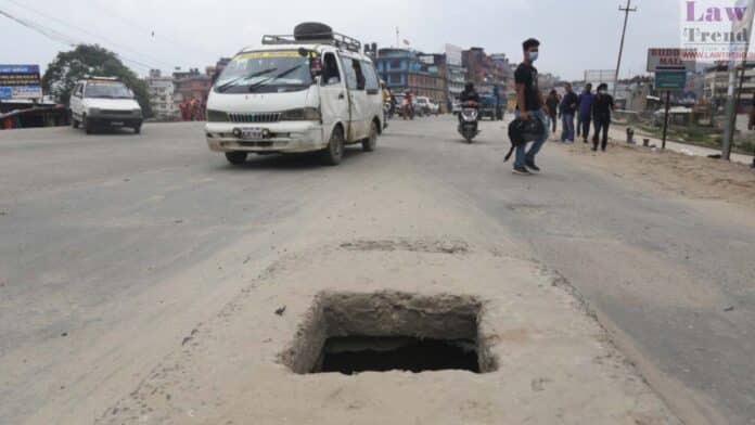 manhole on road accident