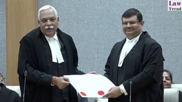 Tejas Karia takes oath as judge